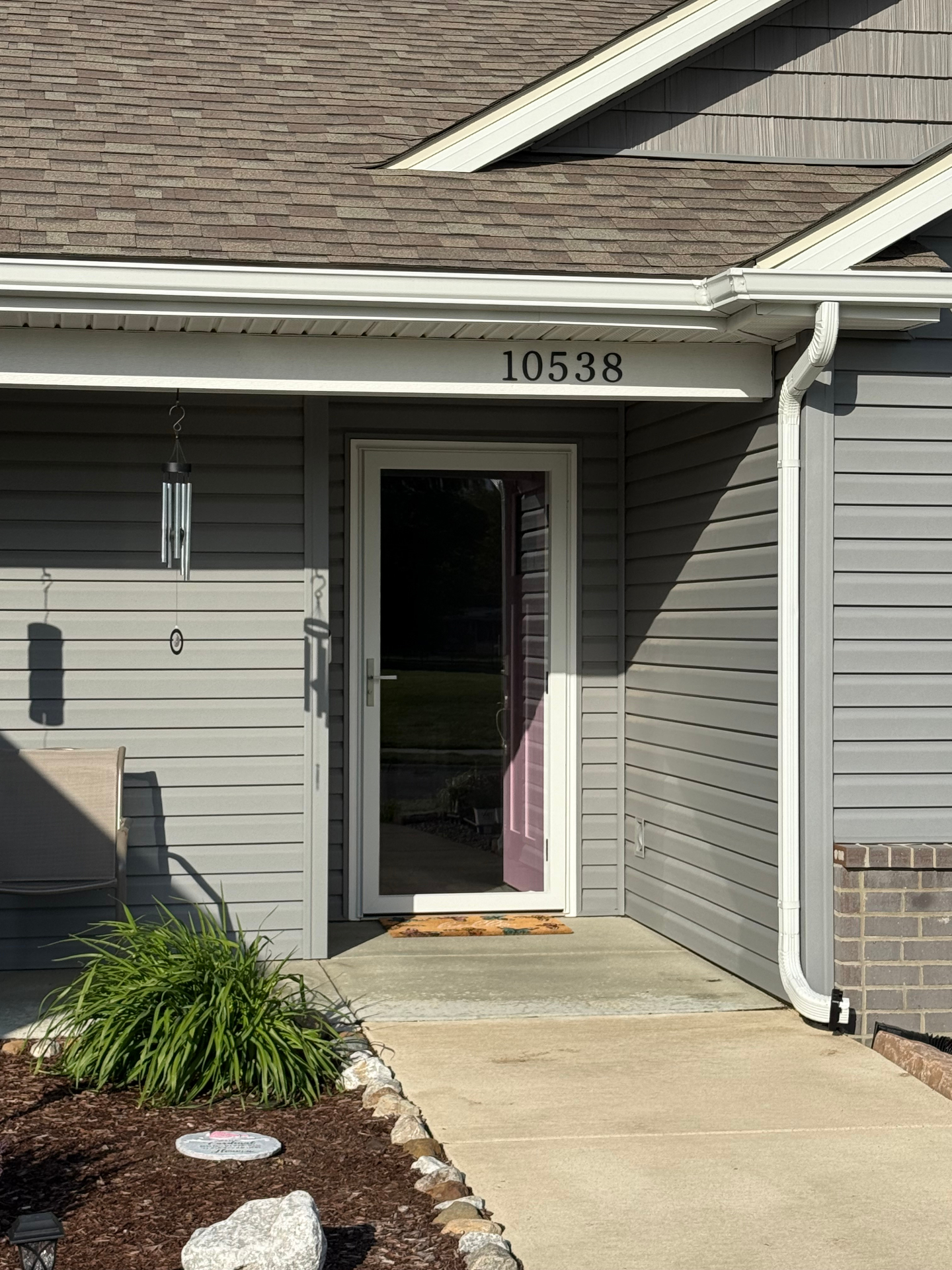Front entry after — new full-view white storm door installed